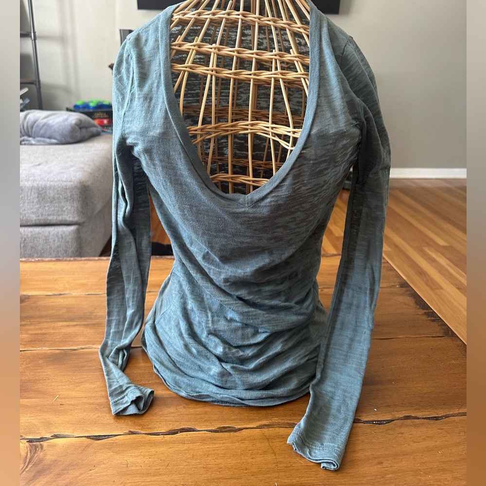 Lightweight semi sheer long sleeve fitted top.